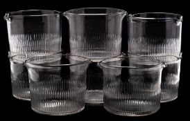 A set of eight Regency glass rinsers: of typical cylindrical form with a pair of pouring lips cut