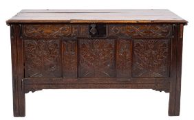 A late 17th Century oak rectangular coffer:, with a plain hinged moulded top,