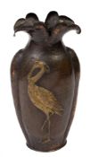 A French Art Nouveau period beaten copper vase: of ovoid form with flared petal-shaped neck,
