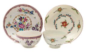 A First Period Worcester teabowl and saucer and one other: the first painted in famille rose style