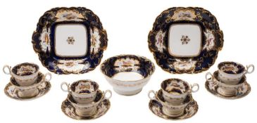 A Coalport Adelaide shape part tea service: enamelled with panels of exotic birds reserved on a