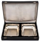 A pair of Indian silver rectangular dishes, stamped silver: of rectangular outline,