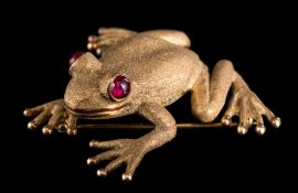Zadora. A frog brooch: with cabochon ruby eyes stamped '14k, Zadora' approximately 34.5mm long, 17.