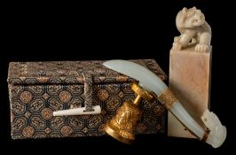 A Chinese jade dragon belt hook and a mythical beast seal: the belt hook with the dragon's head