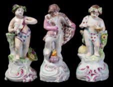 A set of three matched Plymouth porcelain putti emblematic of the Seasons: Winter wearing a fur