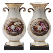 A pair of early 19th century English pearlware vases: of compressed baluster form with scroll