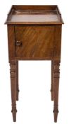 An early 19th Century mahogany pot cupboard:, with a three quarter ledge gallery,