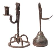 A 17th century wrought iron rush light holder: with hinged scissor action and candlestick holder on