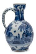A Japanese Arita blue and white jug: of small size with waisted neck and pierced loop handle,