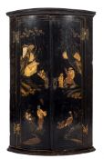 An 18th Century black lacquer and chinoiserie bow fronted hanging corner cupboard:,