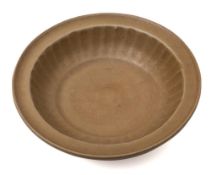 A Chinese Longquan shallow bowl: with flattened everted rim, the interior with ribbed sides,