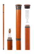 A malacca walking/tipple stick: the screw turn handle enclosing a clear glass phial etched 'Big