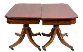 A mahogany twin pillar dining table:, in the Regency taste,