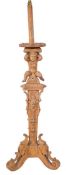 An Italian carved walnut floor lamp:,