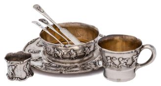 An American sterling silver 'Old King Cole' pattern nursery dinner set, stamped Sterling: inscribed,