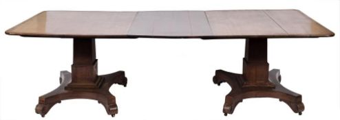 A William IV calamander wood twin pillar dining table:, the top with rounded corners,