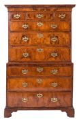 An early 18th Century walnut and cross and feather banded tallboy:,