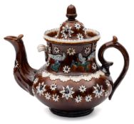 A Measham 'bargeware' teapot: with domed cover and acorn knop, the body sprigged with flower heads,