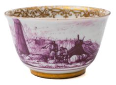 A Meissen teabowl: the exterior painted in puce monochrome with a continuous landscape and estuary