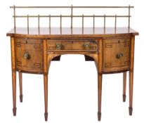 A Regency mahogany and inlaid bow-fronted sideboard:, bordered with boxwood and ebonised lines,
