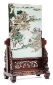 A Chinese famille rose porcelain table screen: enamelled with figures approaching a pagoda and