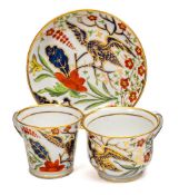 Three Chamberlain Worcester porcelain trios: comprising two cups with 'griffin head' handles and a