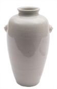 A Chinese blanc de chine ovoid vase: with mythical beast handles,