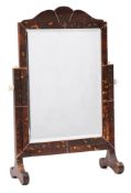 A tortoiseshell veneered toilet mirror: of arched outline with rectangular bevelled mirror plate,