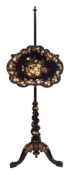 A Victorian ebonised and papier mache pole screen:,