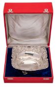 An Indian silver dish, stamped silver: of square outline, with embossed foliate,