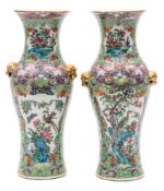 A pair of Chinese porcelain vases: of baluster form with gold mask handles decorated in the rose