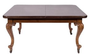 A Victorian mahogany extending dining table on cabriole legs and a set of twelve late 19th century