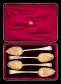 Four Georgian silver and later decorated berry spoons, various makers and dates: with gilded bowls,