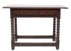 A 17th Century oak rectangular side table:, with an overhanging moulded top,