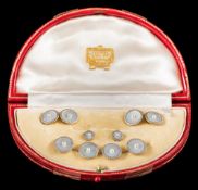 A suite of 18ct gold, mother of pearl and seed-pearl mounted buttons,