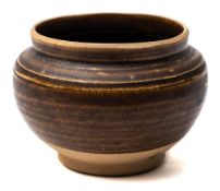 A small Chinese brown-glazed stoneware bowl: of rounded form, the foot unglazed, Song dynasty,