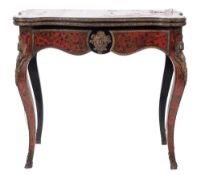 A 19th Century French ebonised and gilt metal mounted card table:, of serpentine outline,