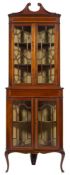 An Edwardian mahogany and inlaid standing corner display cabinet:, in two parts,