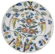 An English delft charger, probably Bristol: painted in red, blue,