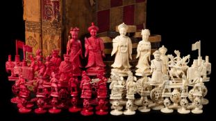 A late 19th century Cantonese Mandarin pattern ivory chess set: one side stained red,