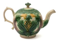 A William Greatbatch lead-glazed creamware teapot and cover: moulded with the 'Basket and