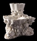 A Plymouth [William Cookworthy] white glazed shell and dolphin centrepiece: in the form of three