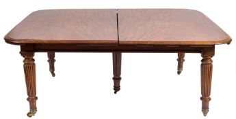 An early 19th Century mahogany extending dining table:, with a telescopic action,