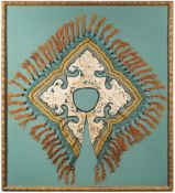A 19th century Chinese collar: of cruciform outline decorated with figures in a pagoda landscape to