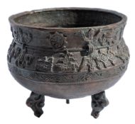 A small Chinese bronze tripod censer: cast with animals and auspicious objects above a wave border,