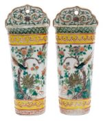 A pair of Chinese famille verte wall pockets: each with ruyi-shaped back and enamelled with a bird