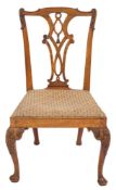 An 18th Century carved walnut dining chair in the Chippendale taste:,