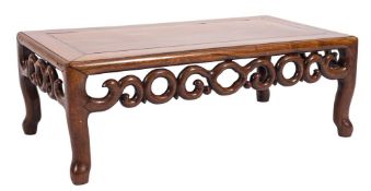 A Chinese Hua Li wood rectangular urn table:, having a pierced scroll frieze on shaped legs,