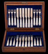 An Edward VII set of twelve silver and mother of pearl handled fruit knives.