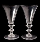 A pair of English wine glasses: each with trumpet shaped bowl and basal collar,